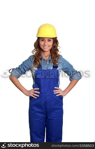 Woman with yellow security helmet standing on white background