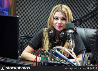Woman Working As Radio DJ Live In Studio