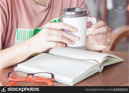 Woman working at coffee shop, stock pgoto