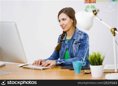 Woman working at desk In a creative office