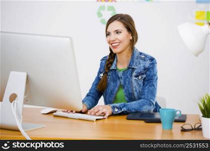 Woman working at desk In a creative office