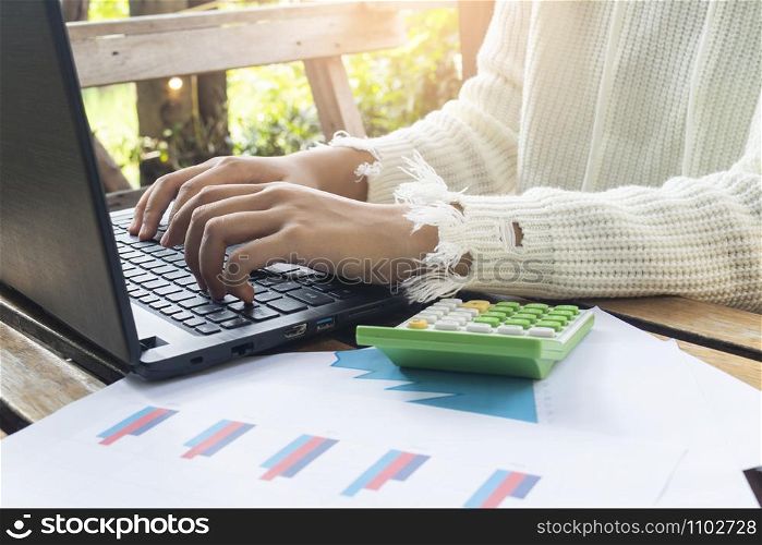 Woman working at home office hand on keyboard close up,Business concept