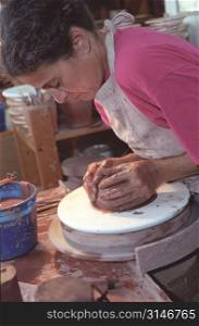 Woman Working At The Pottery Wheel