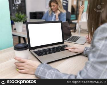 woman working blank laptop