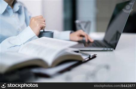 Woman working by using a laptop computer Hands typing on keyboard. Working at office professional investor working new start up project