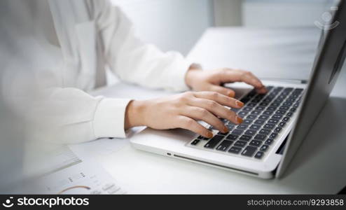 Woman working by using a laptop computer Hands typing on keyboard. writing a blog. Working at home are in hand finger typewriter.