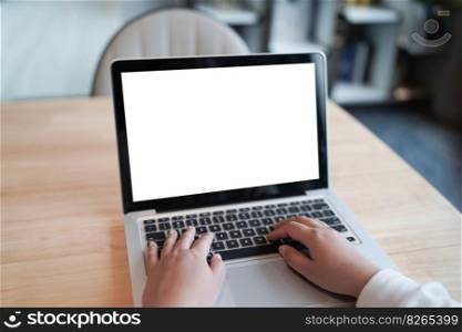 Woman Working by using laptop blank screen computer . Hands typing on a keyboard.technology e-commerce concept