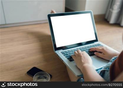 Woman Working by using laptop blank screen computer . Hands typing on a keyboard.technology e-commerce concept