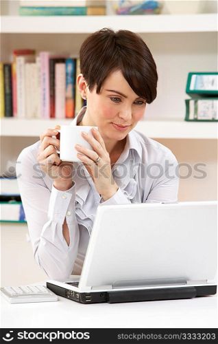 Woman Working From Home Using Laptop