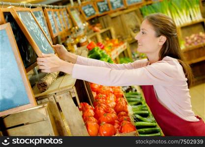 Woman working in a greengrocery