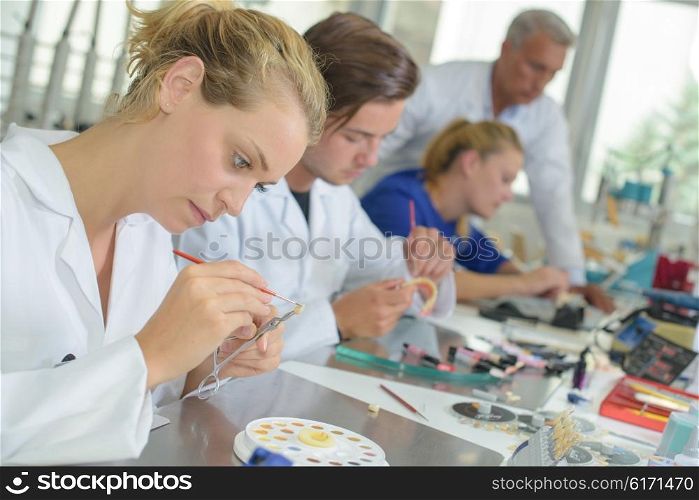 Woman working in dental laboratory