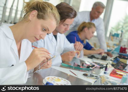 Woman working in dental laboratory