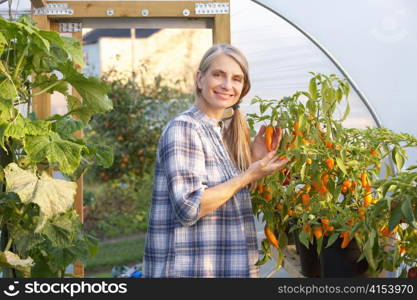 Woman working in greenhouse