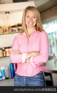 Woman working in hairdressing salon