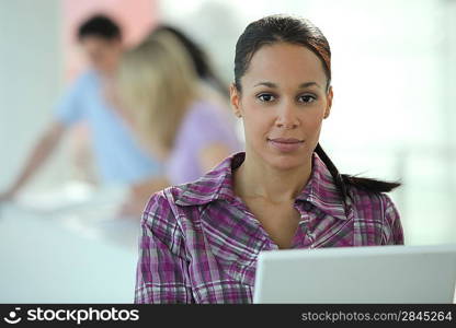 Woman working in open plan office