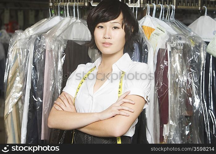 Woman working in the laundrette looking serious