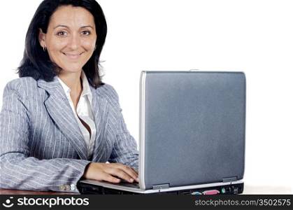 Woman working on a laptop computer a over white background