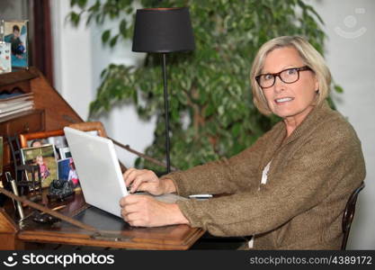 Woman working on her laptop at home