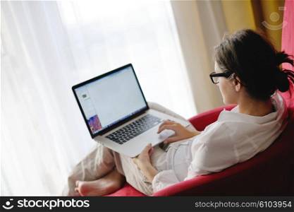 woman working on laptop computer and relax at modern home