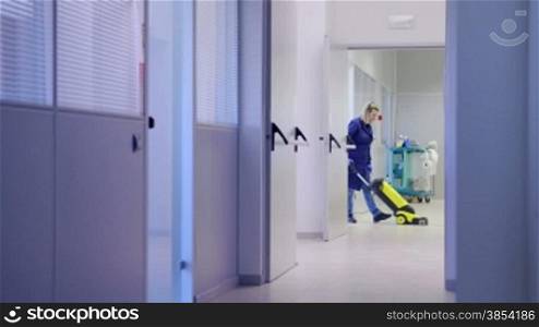 Woman working, professional maid cleaning and washing floor with machinery in industrial building. Sequence