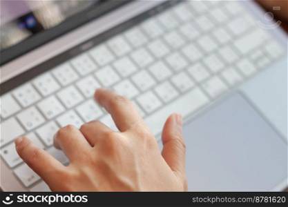 Woman working with a laptop, stock photo