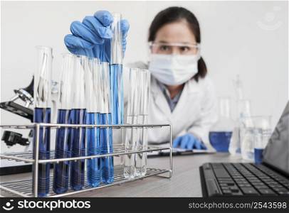 woman working with chemical substances indoors