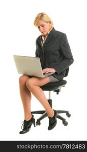 Woman working with laptop and sitting in the chair, white isolated background.