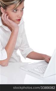 Woman working with laptop and waiting on white background