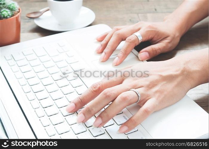 Woman working with laptop computer at home