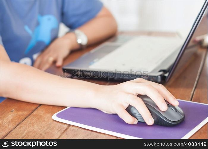 Woman working with laptop, stock photo
