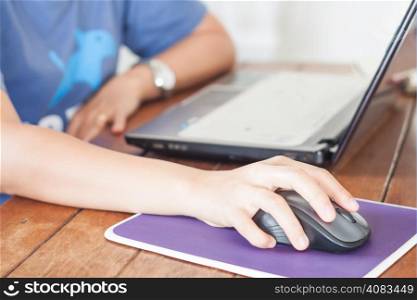 Woman working with laptop, stock photo
