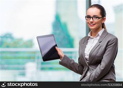 Woman working with tablet in office