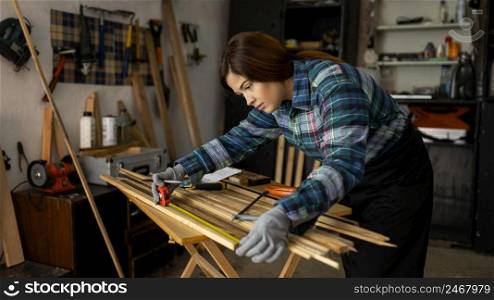 woman working workshop measuring 2