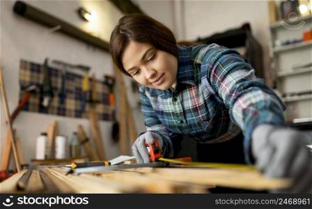 woman working workshop measuring