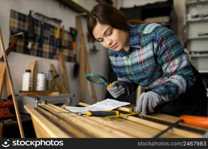 woman working workshop with magnifier glass