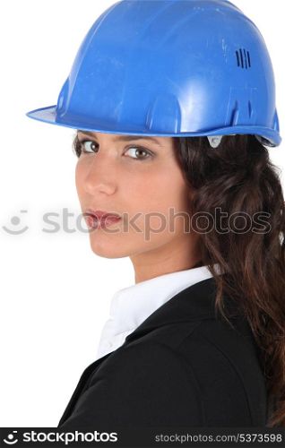 Woman wraing suit and hardhat