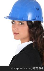 Woman wraing suit and hardhat