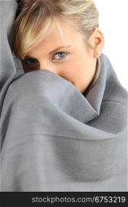 Woman wrapped up in a blanket