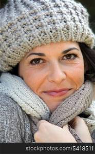 Woman wrapped up in a scarf and hat