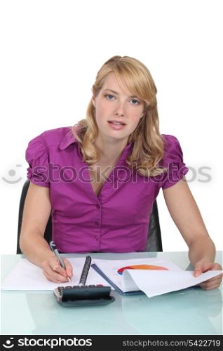 Woman writing a business report