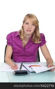 Woman writing a business report