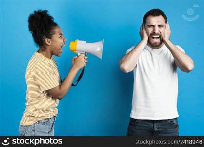 woman yelling man through megaphone