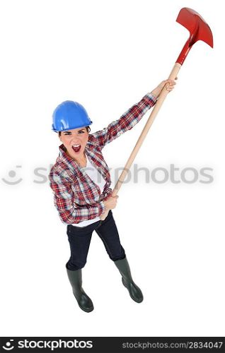 Woman yelling with a shovel in hands