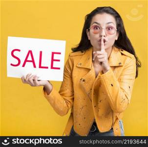 woman yellow jacket silent gesture sales