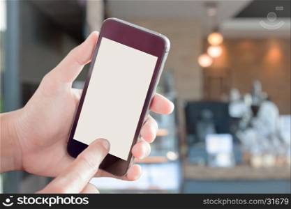 Womanan using smartphone with blurred coffee shop, stock photo