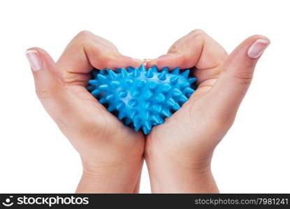 Womans hands with Spiny plastic blue massage ball isolated on white