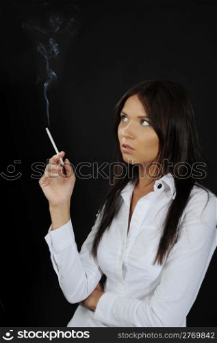 Womant with a cigar in a hand on a black background