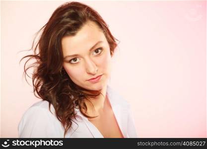 Women and beauty. Portrait of sexy brunette girl long hair on pink