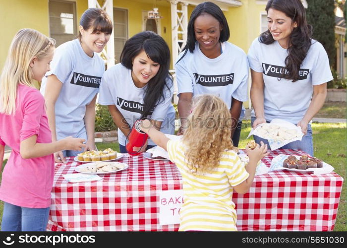 Women And Children Running Charity Bake Sale