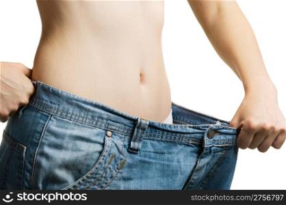 Women and jeans of the greater size. The concept of growing thin. It is isolated on a white background